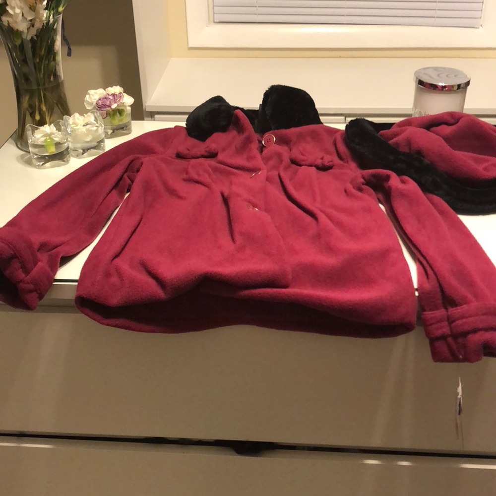 A little girls hat and coat set